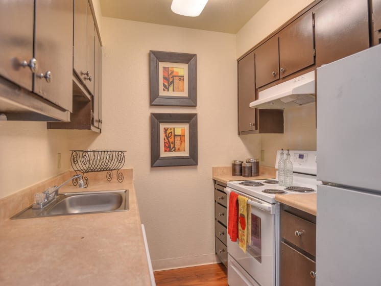 Kitchen with Refrigerator,Stove Range Cooktop Oven Dishwasher, Countertop Hardwood Inspired Floors